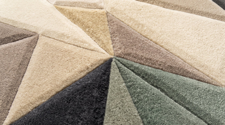 Deeply carved V-shaped grooves on a geometric tufted rug