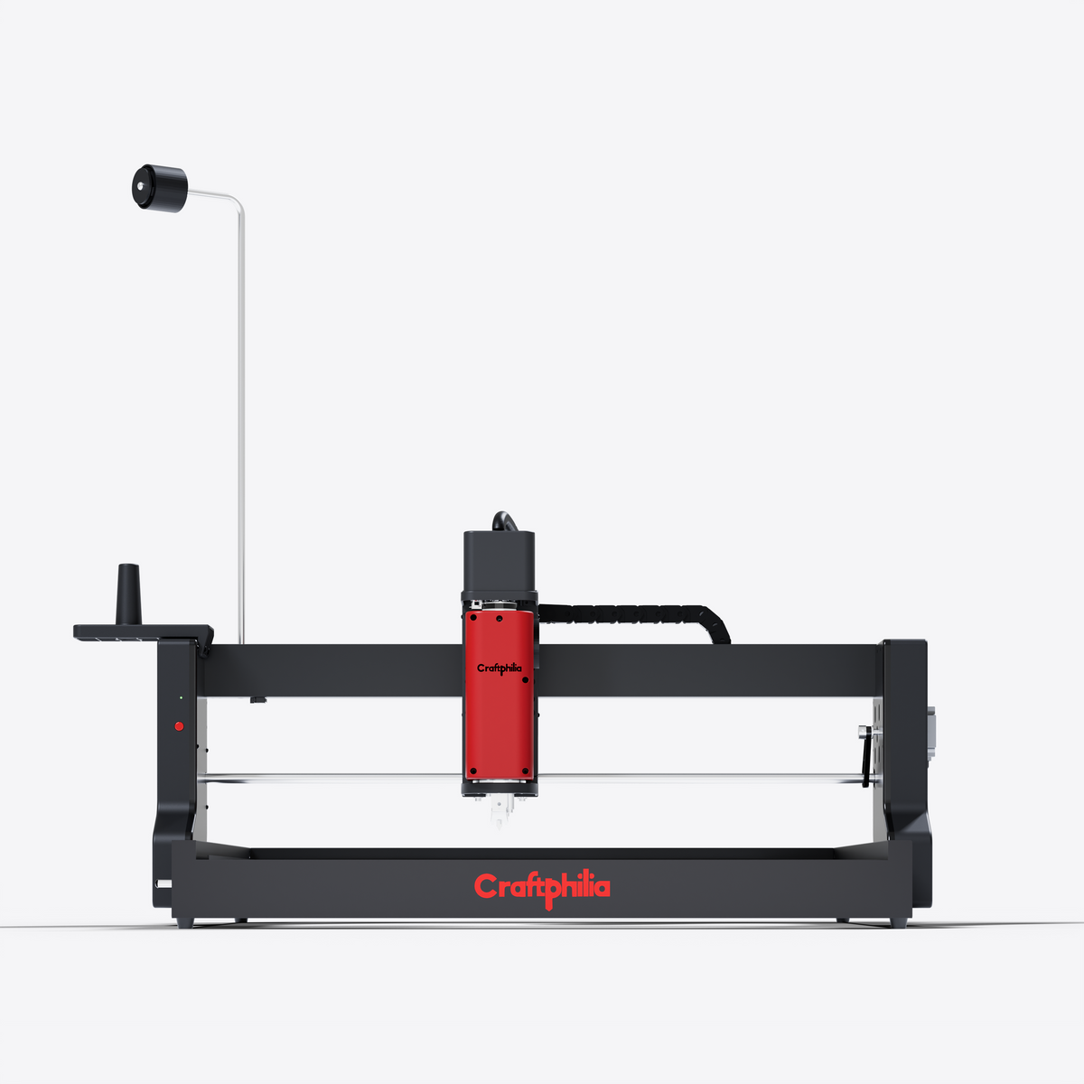 A CraftPhilia 50cm*50cm desktop automatic tufting machine shown in a clean studio shot against a light gray background. The machine features a black metal frame with a prominent red vertical enclosure around the tufting head, a white guide rail.