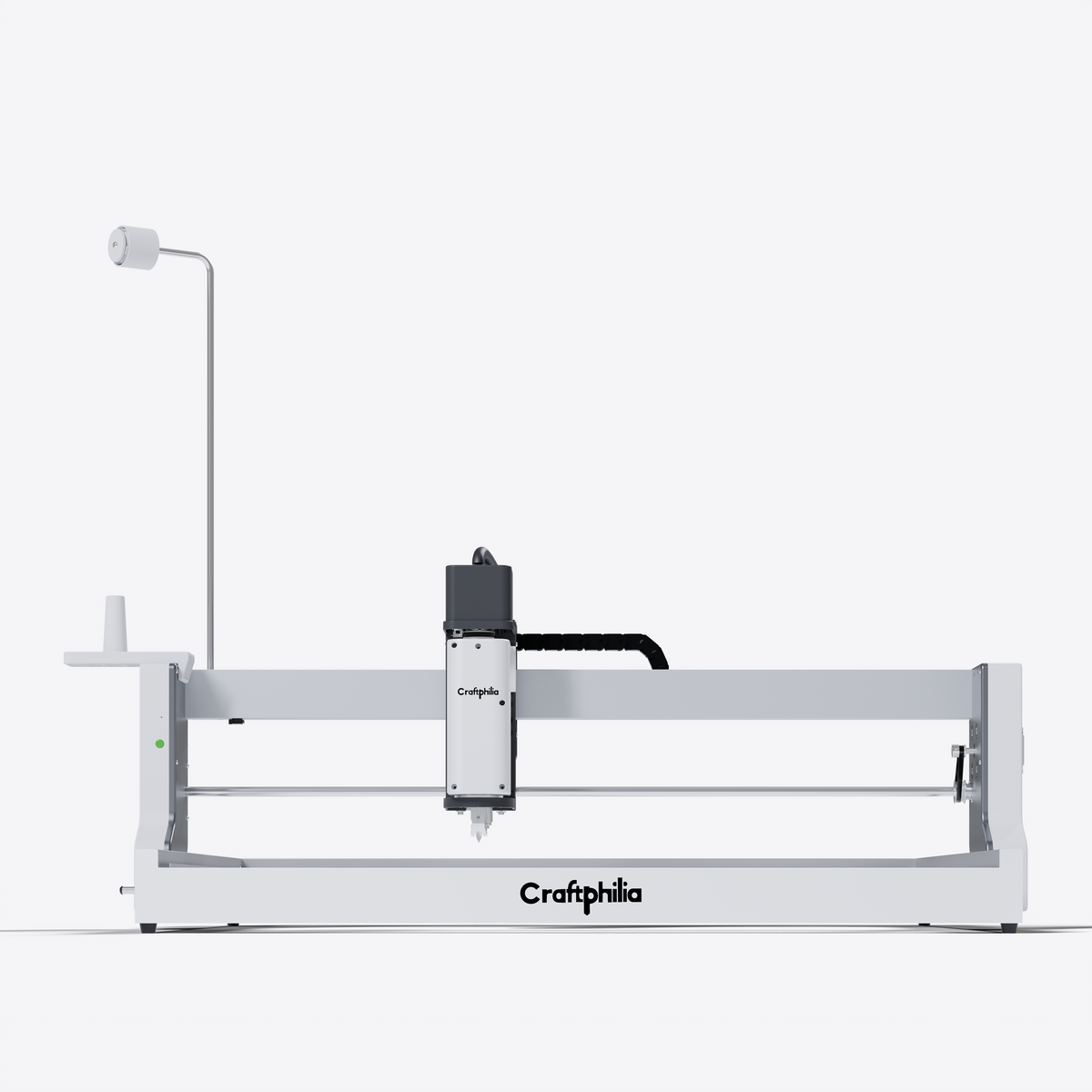 A Craftphilia 70cm*70cm desktop automatic tufting machine shown in a clean studio shot against a white background. The machine features a white metal frame with a black and gray motorized spindle head, a vertical light guide, and the 'Craftphilia' brand name printed on the front.