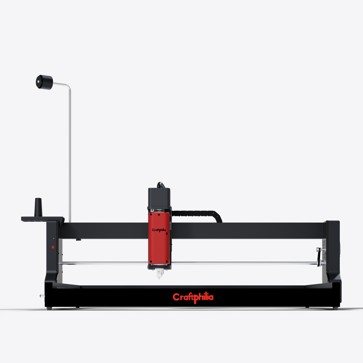 Craftphilia desktop 70cm*70cm automatic tufting machine shown in profile against a solid white background. The machine features a black steel frame with a prominent red vertical tufting head.