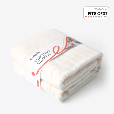A craftphilia folded white cotton tufting cloth with orange stitching, shown on a light gray background with a 'FITS CF07 70x140cm Expansion kit' badge in the top right corner.