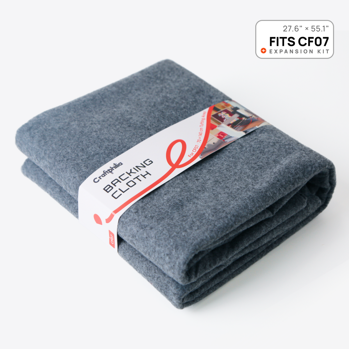 A folded gray backing cloth wrapped with a white paper band labeled 'Craftphilia Backing Cloth,' shown on a clean white background with a small '27.6 × 55.1 inch FITS CF07 EXPANSION KIT' badge in the top right.
